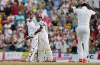 Cricket - West Indies v England - Third Test - Kensington Oval, Barbados - 3/5/15 West Indies' Denesh Ramdin and Jermaine Blackwood celebrate their victory Action Images via Reuters / Jason O'Brien