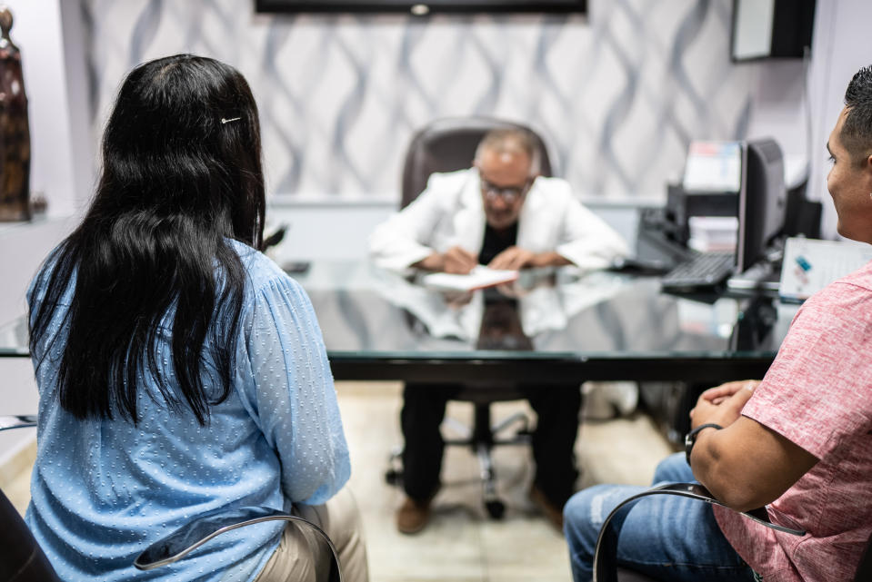 A couple speaking with a doctor