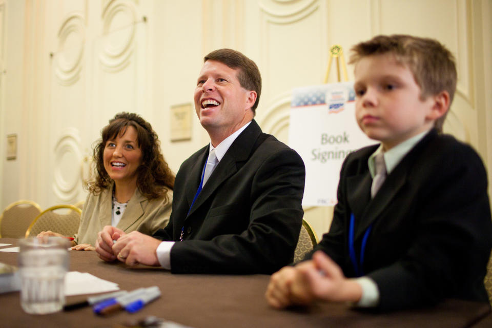 WASHINGTON - SEPTEMBER 17: Michelle Duggar and Jim Bob Duggar, stars of The Learning Channel TV show '19 Kids and Counting,' pose for a picture with a fan while signing copies of their book at the Values Voter Summit on September 17, 2010 in Washington, DC. The annual summit drew nearly two thousand people to advocate for conservative causes. (Photo by Brendan Hoffman/Getty Images)