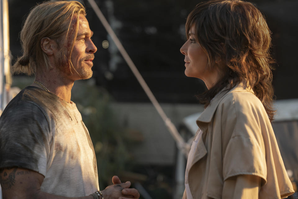 This image released by Sony Pictures shows Brad Pitt, left, and Sandra Bullock in a scene from the film "Bullet Train." (Scott Garfield/Sony Pictures via AP)