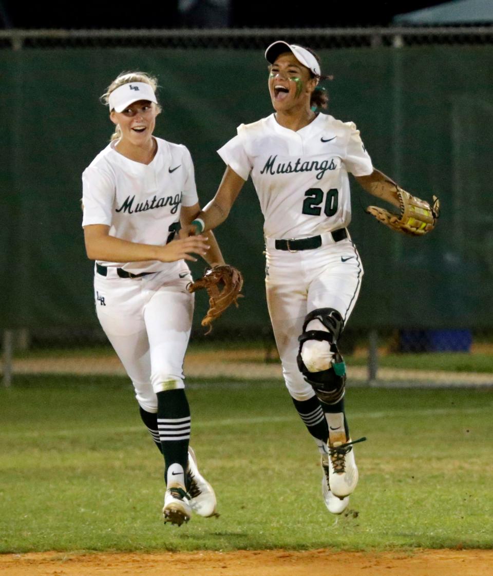 Lakewood Ranch's Allyson Bruneman, left, and Sydney McCray celebrate Lakewood Ranch's 1-0 victory over Venice in the Class 7A-District 8 softball final Thursday night at Lakewood Ranch High.