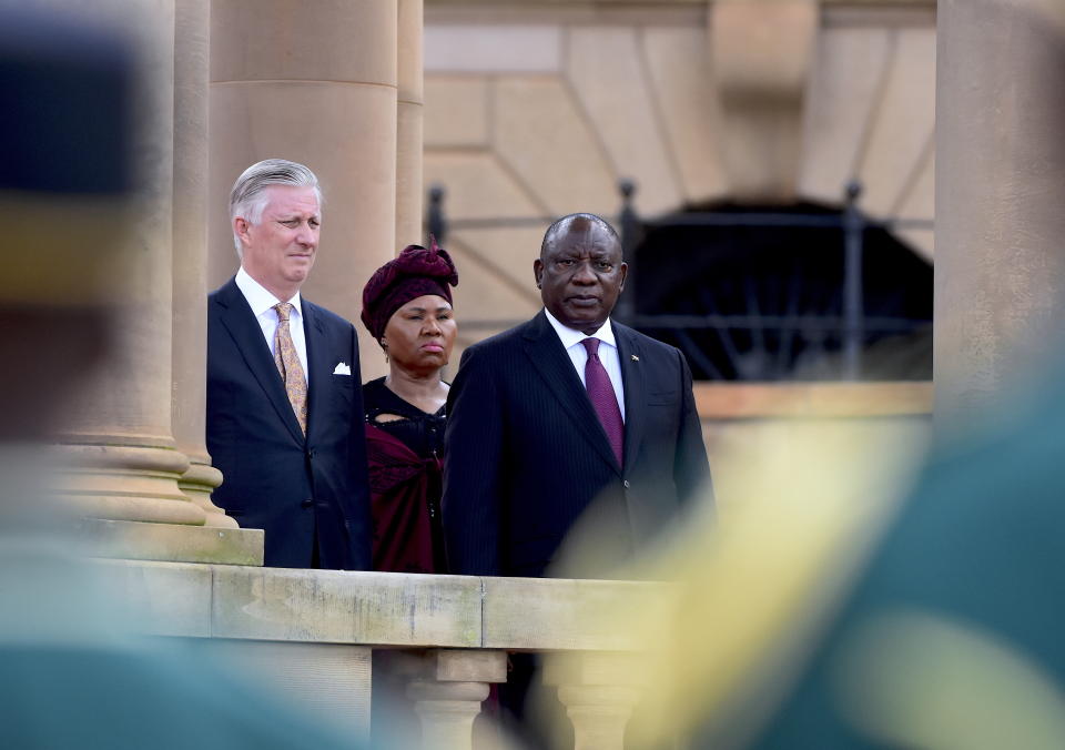 King Philippe of Belgium , left. and South African President Cyril Ramaphosa, right, listen to national anthems at a welcoming ceremony in Pretoria, South Africa, Thursday, March 23, 2023. The King and Queen Mathilde are on a four-day state visit to South Africa. (AP Photo/Frans Sello waga Machat)