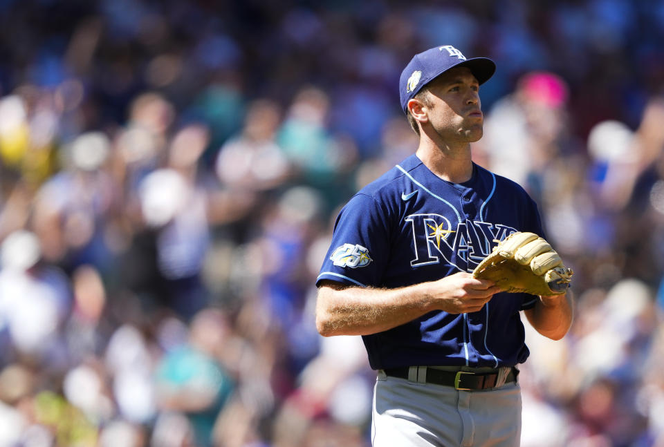 Tampa Bay Rays relief pitcher Jason Adam reacts to hitting Seattle Mariners' Jose Caballero with a pitch with the bases loaded to drive in a run during the seventh inning of a baseball game, Sunday, July 2, 2023, in Seattle. (AP Photo/Lindsey Wasson)