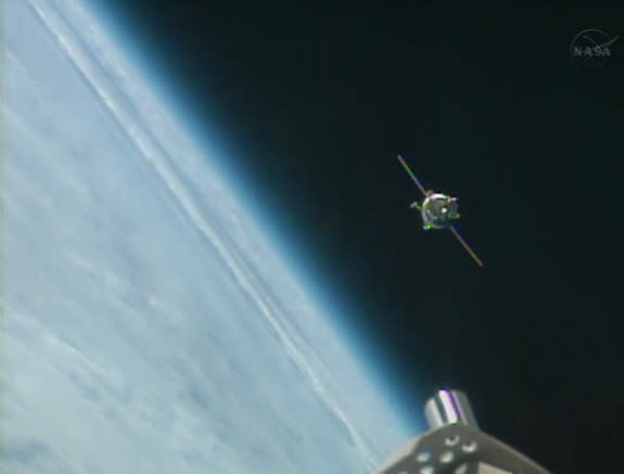 A Russian Soyuz spacecraft carrying three new crewmembers is seen approaching the International Space Station on Sept. 25, 2013. The Soyuz ferried American astronaut Mike Hopkins and Russian cosmonauts Oleg Kotov and Sergey Ryazanskiy to the sp