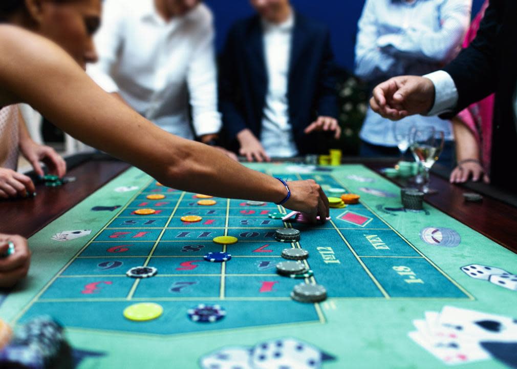 People playing roulette in a casino.