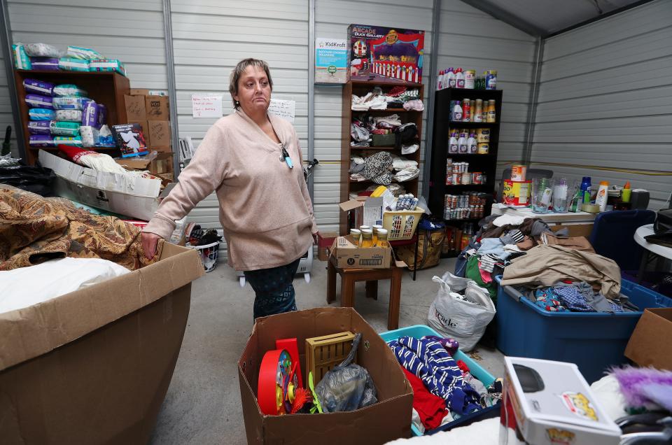 Donna Roark says that she and her husband are thankful they were spared the devastating effects of this year's flood but felt compelled to help others by starting The People's Building in Littcarr, Kentucky. She has been seeking donations so she can distribute essential items to people who are still recovering after losing property and belongings in the aftermath of the flood.
(Photo: Sam Upshaw Jr./Courier Journal)