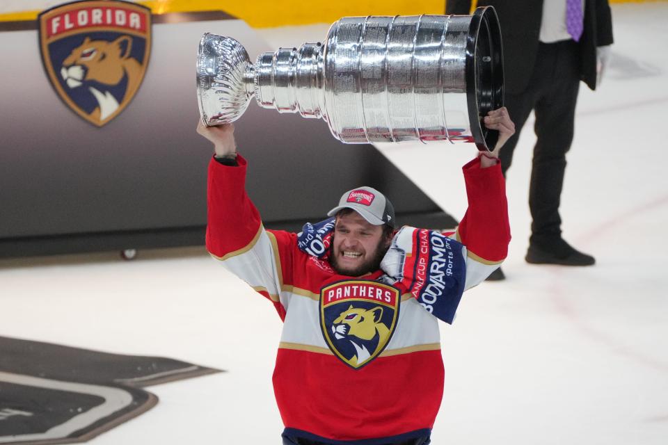 Florida Panthers forward Aleksander Barkov (16) hoists the Stanley Cup after defeating the Edmonton Oilers.