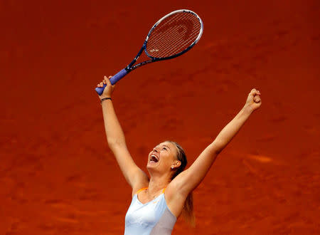 FILE PHOTO - Russia's top seed and holder Maria Sharapova celebrates her victory against China's Li Na in the final of the Stuttgart tennis Grand Prix April 28, 2013. REUTERS/Michael Dalder/File Photo