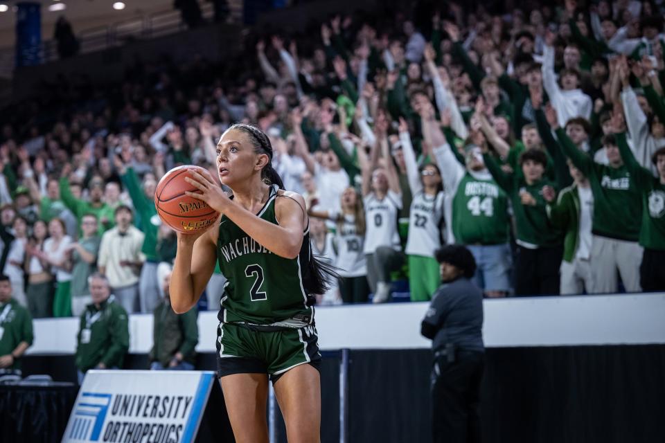 With Wachusett fans on their feet, senior Mary Gibbons shoots against Bishop Feehan in Friday night's Division 1 state final.