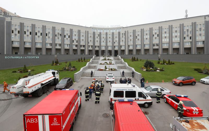 Emergency specialists work on a site of fire, that killed five novel coronavirus patients in an intensive care unit, at a hospital in Saint Petersburg