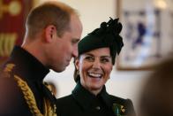<p>Kate and Will laugh together during their visit to the St. Patrick's Day Parade in Hounslow, England. </p>