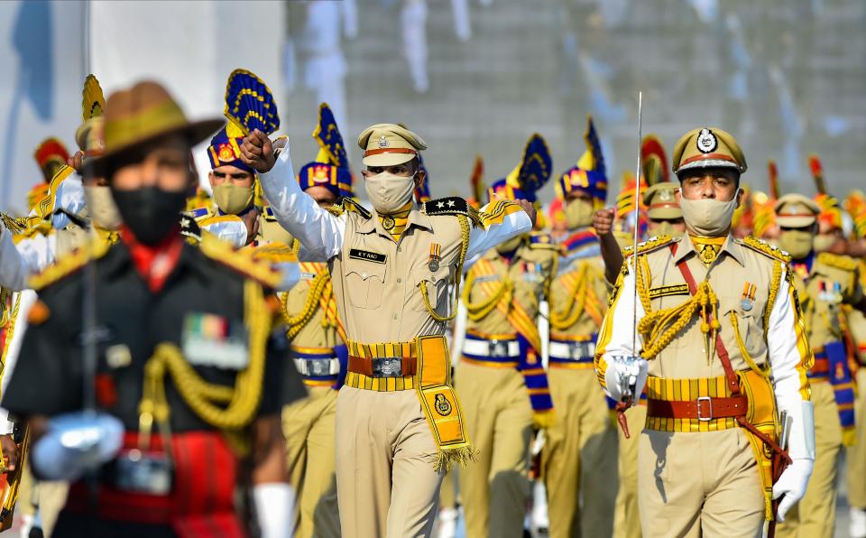 Police personnel perform a march-past during a parade on the occasion of National Police Commemoration Day, at Police Memorial in New Delhi, Wednesday, 21 October, 2020.