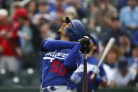 Los Angeles Dodgers' Mookie Betts watches his infield pop fly during the first inning of a spring training baseball game against the Cincinnati Reds, Monday, March 2, 2020, in Goodyear, Ariz. (AP Photo/Ross D. Franklin)