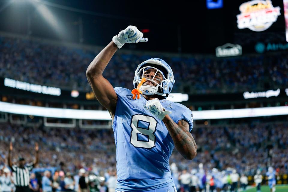 North Carolina wide receiver Kobe Paysour celebrates after his touchdown catch during the first half of an NCAA college football game against South Carolina, Saturday, Sept. 2, 2023, in Charlotte, N.C. (AP Photo/Erik Verduzco)