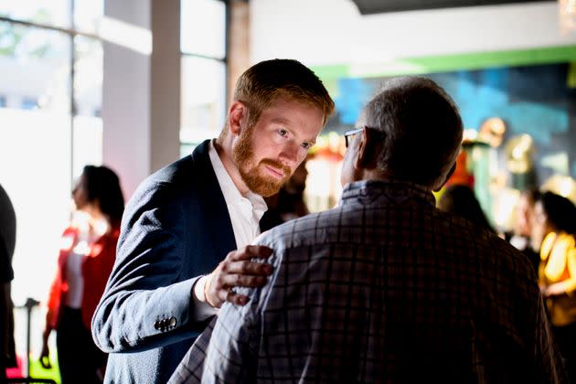 U.S. Rep. Peter Meijer (R-Mich.) speaks with potential voters before an event for the West Michigan Hispanic Chamber of Commerce in Grand Rapids on July 26. (Photo: Brittany Greeson for HuffPost)