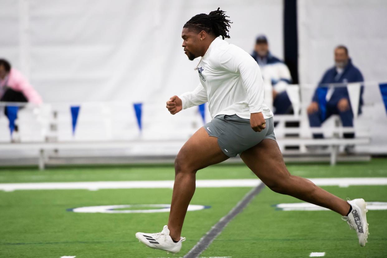 Offensive lineman Caedan Wallace participates in a drill during Penn State's Pro Day on March 15, 2024, in State College.