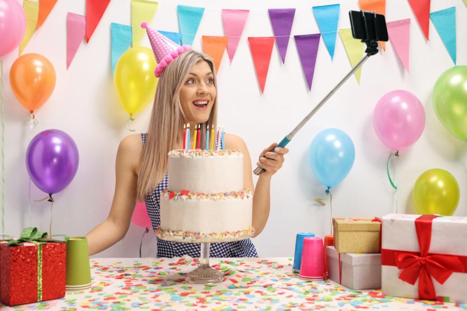 young pretty girl celebrating her birthday and taking a selfie