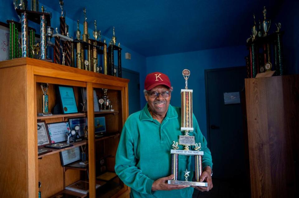 George Blue shows a Lodge of the Year trophy on April 1, awarded to the Prince Hall Freemasons lodge in 2003. Membership have dwindled and they’re currently struggling to keep a partial property tax exemption because the state has ruled that the building isn’t in use enough.