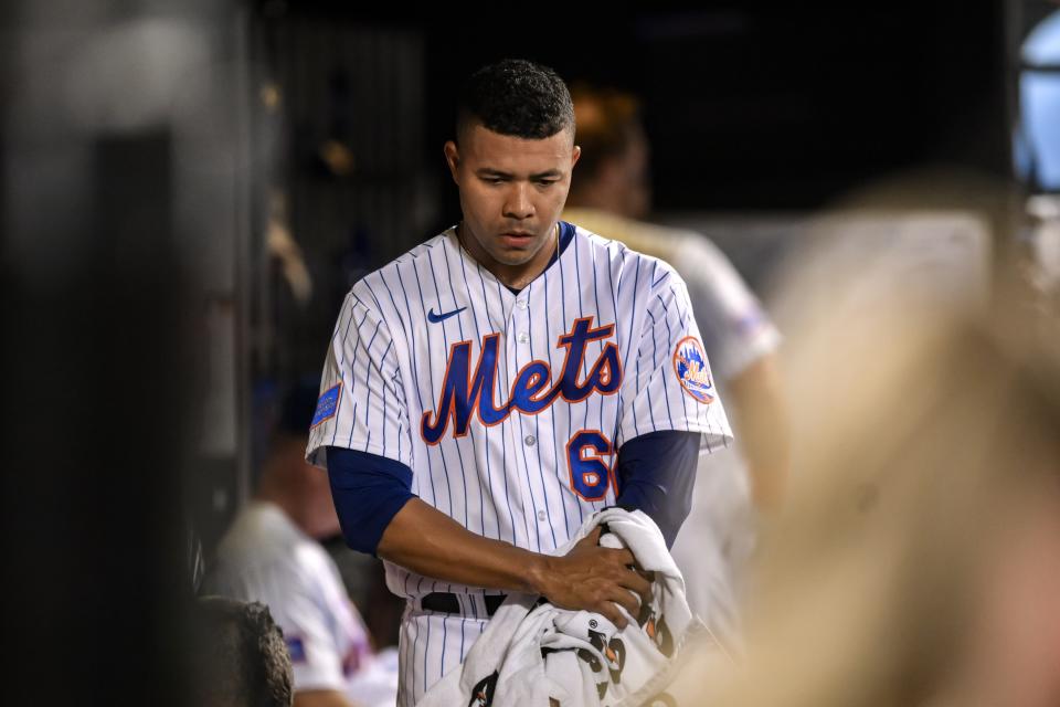 New York Mets starting pitcher Jose Quintana (62) towels off in the dugout during the fifth inning against the Atlanta Braves on Aug. 12, 2023, at Citi Field.