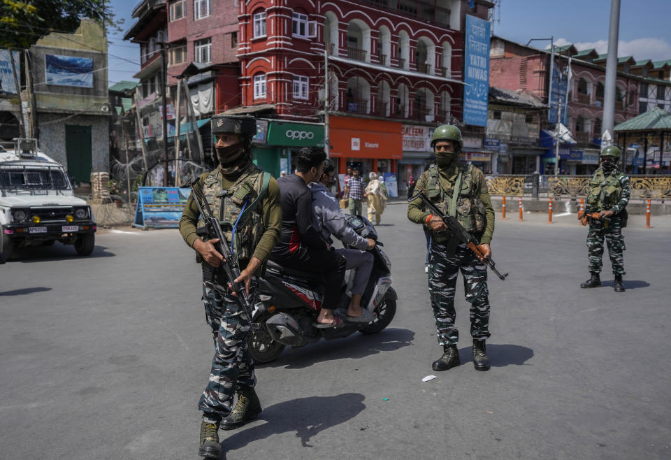 Indian paramilitary soldiers patrol in Srinagar, Indian controlled Kashmir, Thursday, June 2, 2022. Assailants fatally shot a Hindu bank manager in Indian-controlled Kashmir on Thursday, said police, who blamed militants fighting against Indian rule for the attack. (AP Photo/Mukhtar Khan)