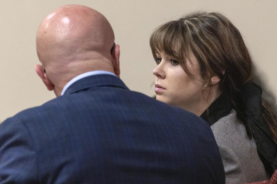 Defendant Hannah Gutierrez-Reed, former armorer on the set of the movie Rust, speaks with her defense attorney, Jason Bowles, during her trial at District Court, Monday, Feb. 26, 2024, in Santa Fe, N.M. Gutierrez-Reed is charged with involuntary manslaughter and tampering with evidence in the October 2021 death of cinematographer Halyna Hutchins during the filming of the Western. (Luis Sánchez Saturno/Santa Fe New Mexican via AP, Pool)