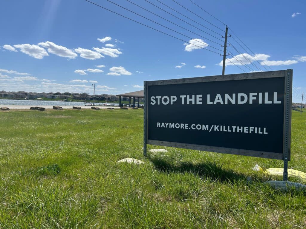 A sign just outside Creekmoor, a golf course subdivision in Raymore, implores drivers to stop a proposed landfill less than a mile away.