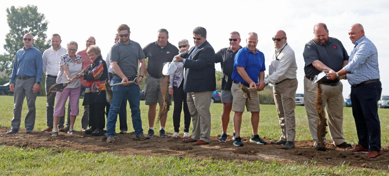 People pose for a photo during the groundbreaking of the new Public Works Campus, Wednesday, Sept. 7, 2022, in Lafayette, Ind. 