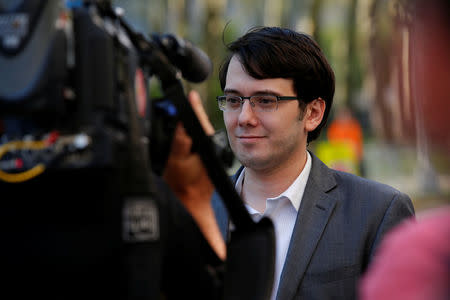 Former drug company executive Martin Shkreli is surrounded by news cameras as he exits U.S. District Court following the second day of jury deliberations in his securities fraud trial in the Brooklyn borough of New York City, U.S., August 1, 2017. REUTERS/Mike Segar