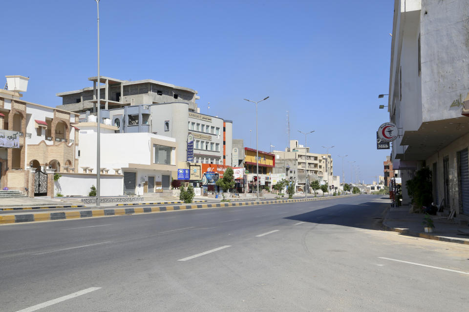 A deserted street is seen during clashes between rival militias in Tripoli, Libya, Tuesday, Aug. 15, 2023. According to local media, fighting broke out between the 444 brigade and the Special Deterrence Force late Monday evening. (AP Photo/Yousef Murad)