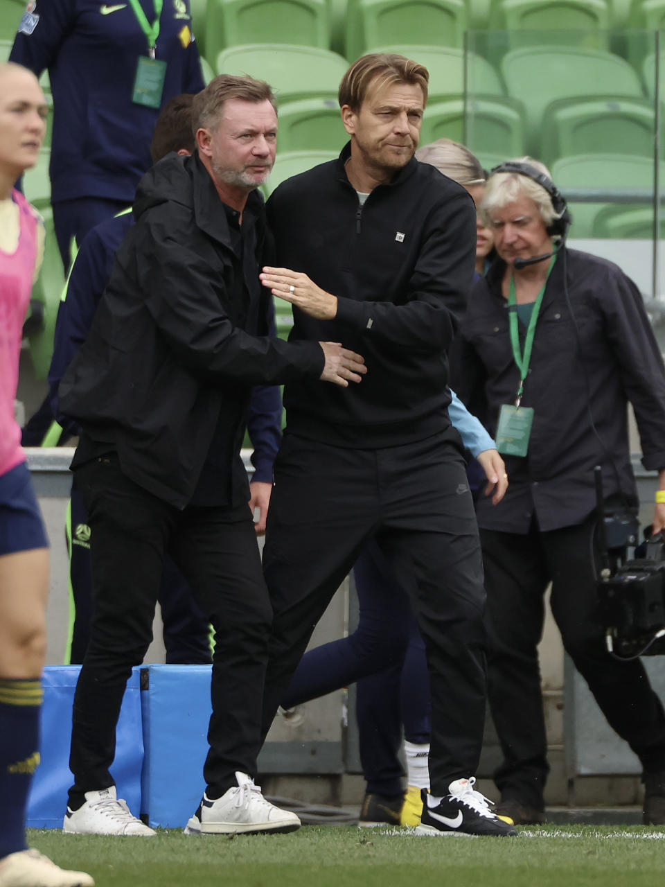 Sweden's head coach Peter Gerhardsson, left, shakes hands with Australia's head coach Tony Gustavsson after their women's friendly soccer match in Melbourne, Australia, Saturday, Nov. 12, 2022. (Asanka Brendon Ratnayake)