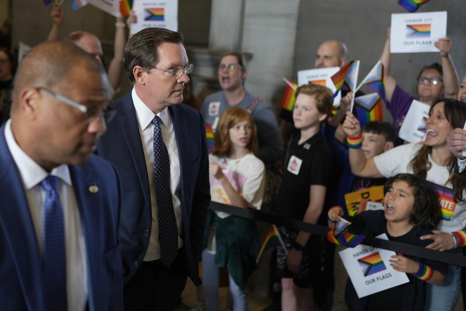 House Speaker Cameron Sexton, R-Crossville, walks past protesters before a legislative session Monday, Feb. 26, 2024, in Nashville, Tenn. (AP Photo/George Walker IV)