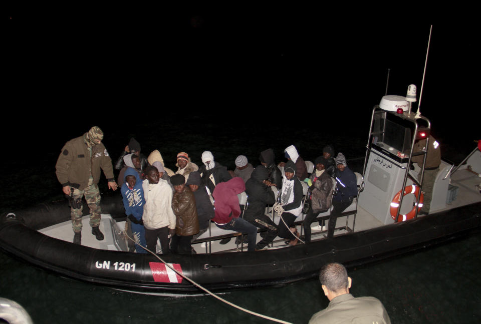 Migrants, mainly from sub-Saharan Africa, are stopped by Tunisian Maritime National Guard at sea during an attempt to get to Italy, near the coast of Sfax, Tunisia, Tuesday, April 18, 2023. The Associated Press, on a recent overnight expedition with the National Guard, witnessed migrants pleading to continue their journeys to Italy in unseaworthy vessels, some taking on water. Over 14 hours, 372 people were plucked from their fragile boats (AP Photo)