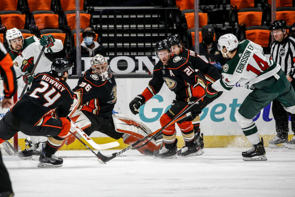 Minnesota Wild forward Joel Eriksson Ek (14) shoots as Anaheim Ducks goalie John Gibson (36) defends during the second period of an NHL hockey game Saturday, Feb. 20, 2021, in Anaheim, Calif. (AP Photo/Ringo H.W. Chiu)