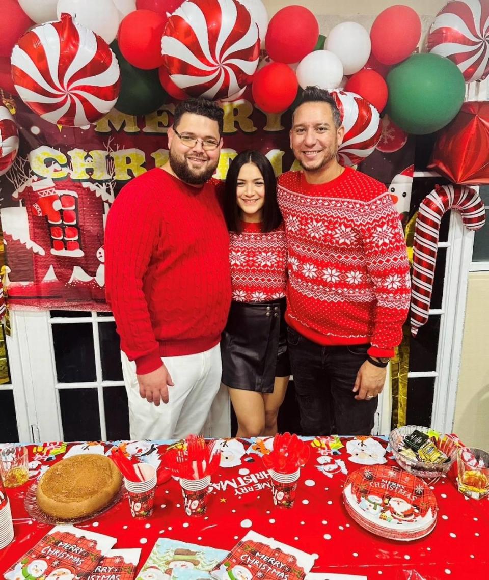 (L) Miguel Jerez, 34, (C) Yarinis Jerez, center, 30, and (R) Carlos Milan, Yaniri´s fiancee 38 years old in a Christmas celebration before the incident that changed their lives with the shooting in Martini Bar on April 6. The Jerez´s siblings are filing a lawsuit against the nighclub and CityPlace for negligent