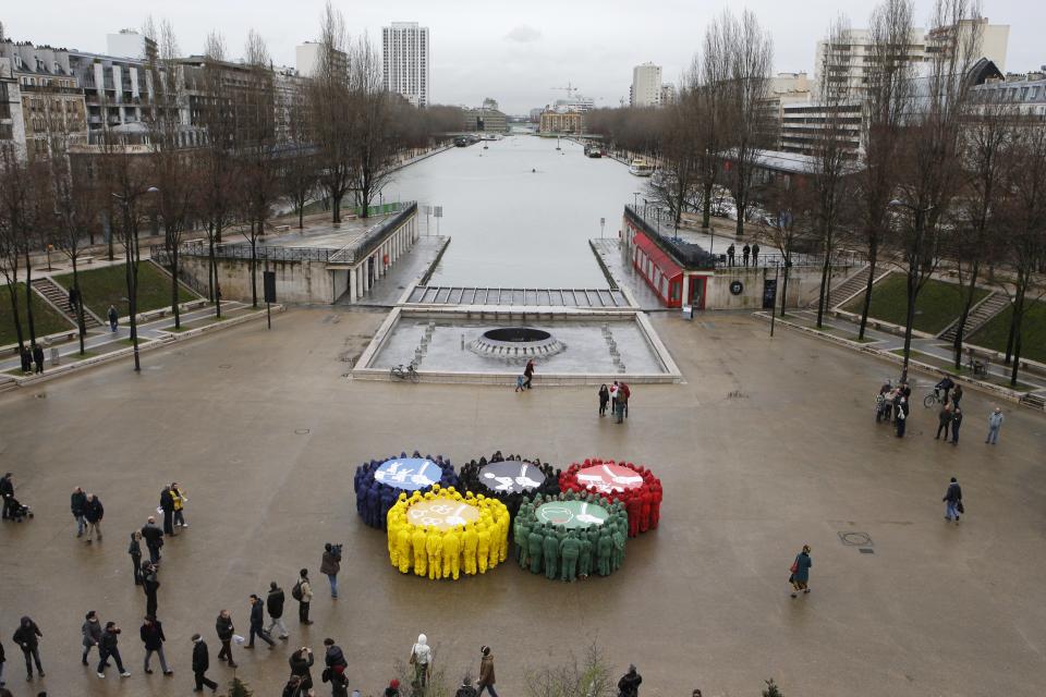 Olympic rings are displayed as part of a protest by human rights organisations a week before the Sochi winter Olympic Games in Paris