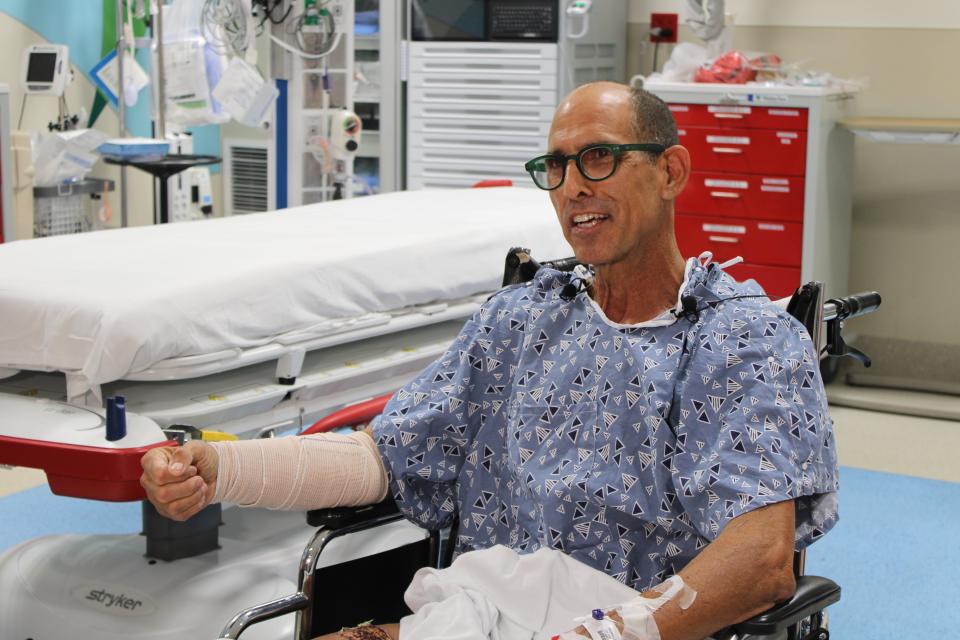 Steven Reinhardt, 60, of Palm Beach Gardens grins as he shares his shark attack survival story. He sustained a shark bite while on a morning swim on Nov. 5, 2023, near Lost Tree Village in Juno Beach. The shark bite led to numerous lacerations on his right arm.