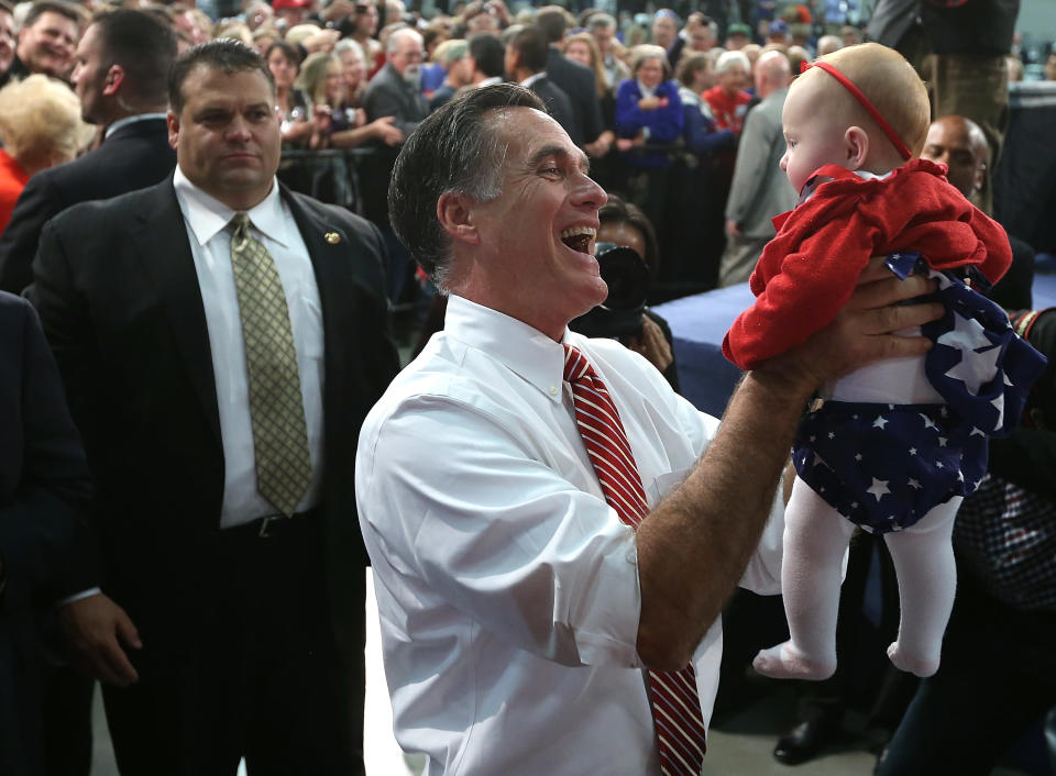 Republican presidential candidate, former Massachusetts Gov. Mitt Romney holds a baby during a campaign event at Meadow Event Park on November 1, 2012 in Doswell, Virginia. (Photo by Justin Sullivan/Getty Images)