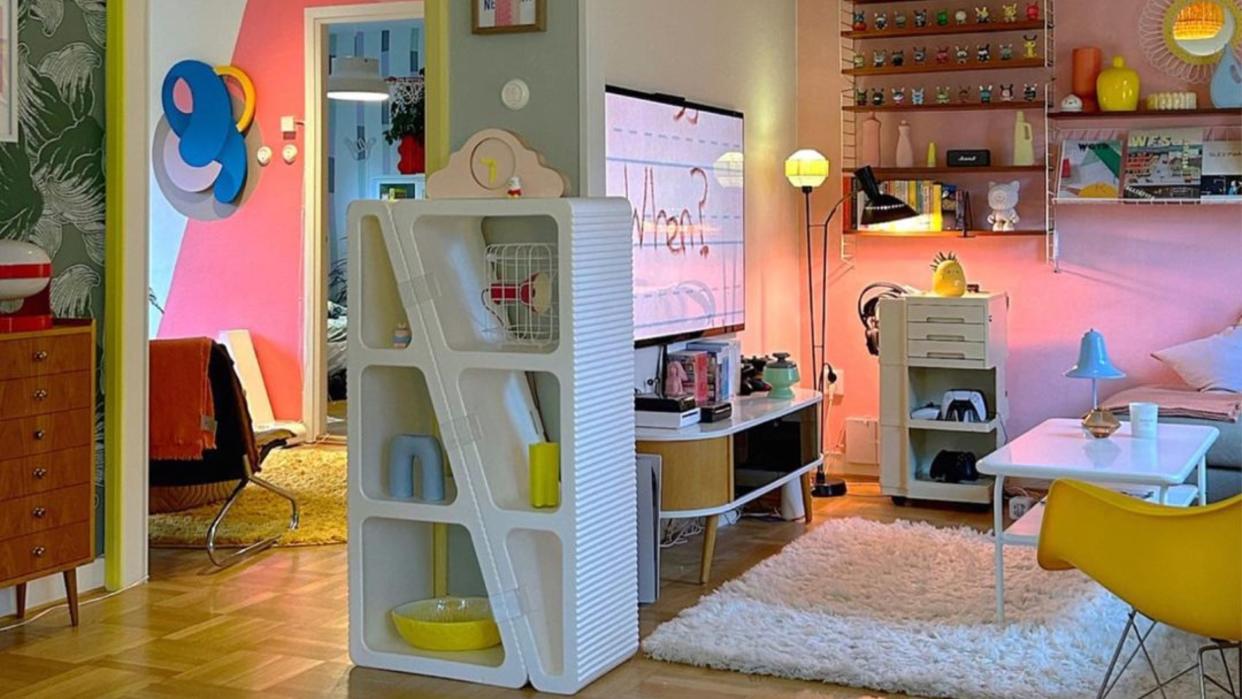  Colorful living room with white shleves. 