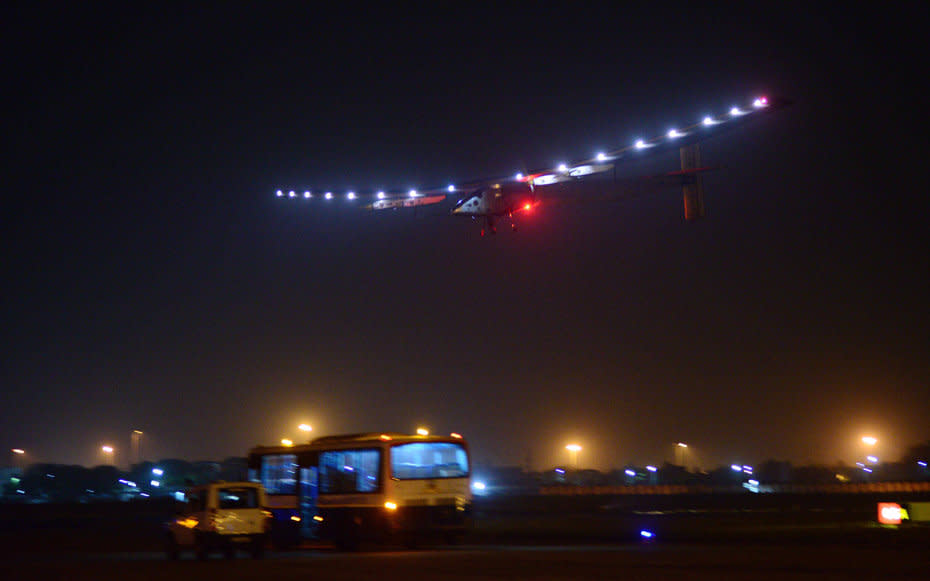 Solar Impulse lights up the night's sky at Ahmedabad airport, in India, on March 10, 2015.