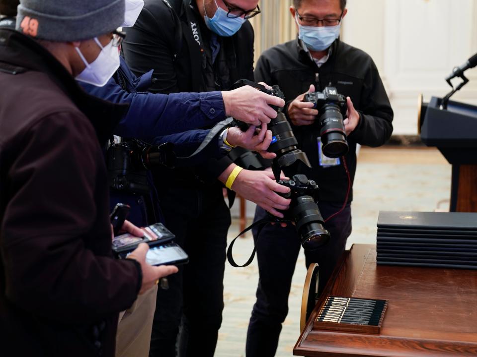 Photojournalists Shooting Biden Pens