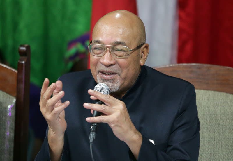 Suriname's President Desi Bouterse, who was convicted of murder for the execution of opponents by a court in Suriname, addresses the media after arriving from China, in Paramaribo