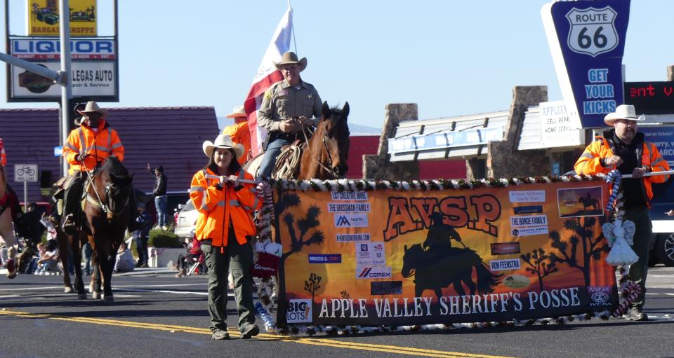 San Bernardino County Sheriff Shannon Dicus rides with the Apple Valley Sheriff's Posse in the Victorville Kiwanis Club’s 76th Annual Children’s Christmas Parade on Saturday, Dec. 2, 2023.