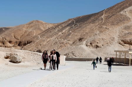FILE PHOTO: Tourists walk near the newly renovated tomb of boy pharaoh King Tutankhamun in Valley of the Kings in Luxor