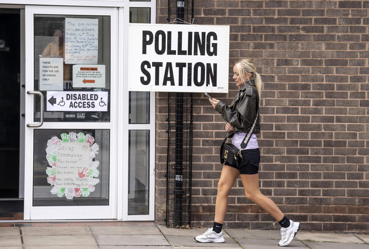 A woman walks past a polling station sign outside Selby Community Centre in Selby North Yorkshire, during voting for the Selby and Ainsty by-election, called following the resignation of incumbent MP Nigel Adams. Picture date: Thursday July 20, 2023. (Photo by Danny Lawson/PA Images via Getty Images)