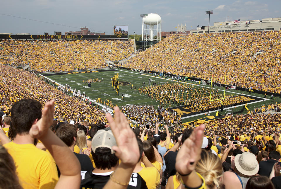 IOWA CITY, IOWA- SEPTEMBER 16:  Fans cheer as the Iowa Hawkeyes take the field before the match-up against the North Texas Mean Green on September 16, 2017 at Kinnick Stadium in Iowa City, Iowa.  (Photo by Matthew Holst/Getty Images)