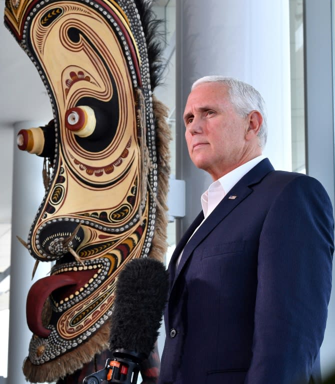 Vice President Mike Pence (pictured next to a traditional mask display) represented the US after Donald Trump decided to skip the summit