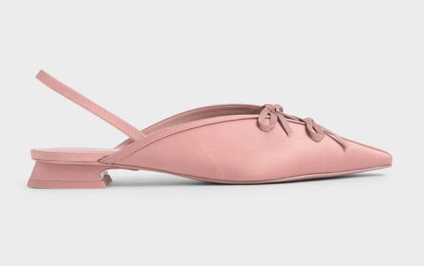 <p>Charles & Keith Satin Double Bow Slingback Flats, $43, <a href="https://rstyle.me/+MtESszI_zvbB2nKNgYyCiQ" rel="nofollow noopener" target="_blank" data-ylk="slk:available here;elm:context_link;itc:0;sec:content-canvas" class="link ">available here</a>.</p>