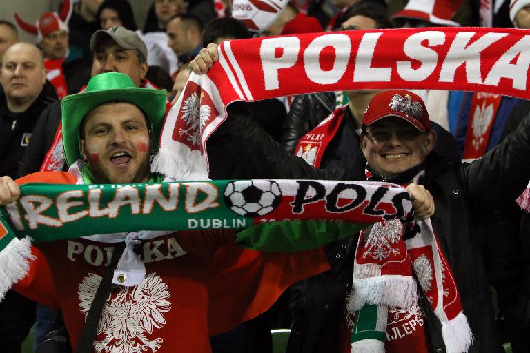 Polish supporters celebrate after the Euro 2016 qualifying football match between Ireland and Poland in Dublin on March 29, 2015