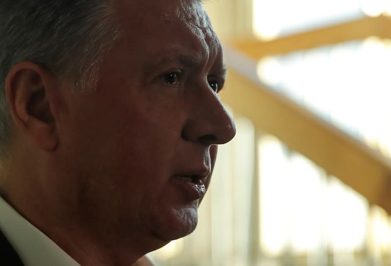 Suspended president of Russia's athletics federation Dmitry Shlyakhtin speaks to journalists at the Russia's Olympic Committee building in Moscow