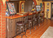 <p>And the kitchen and bar area. (Airbnb) </p>